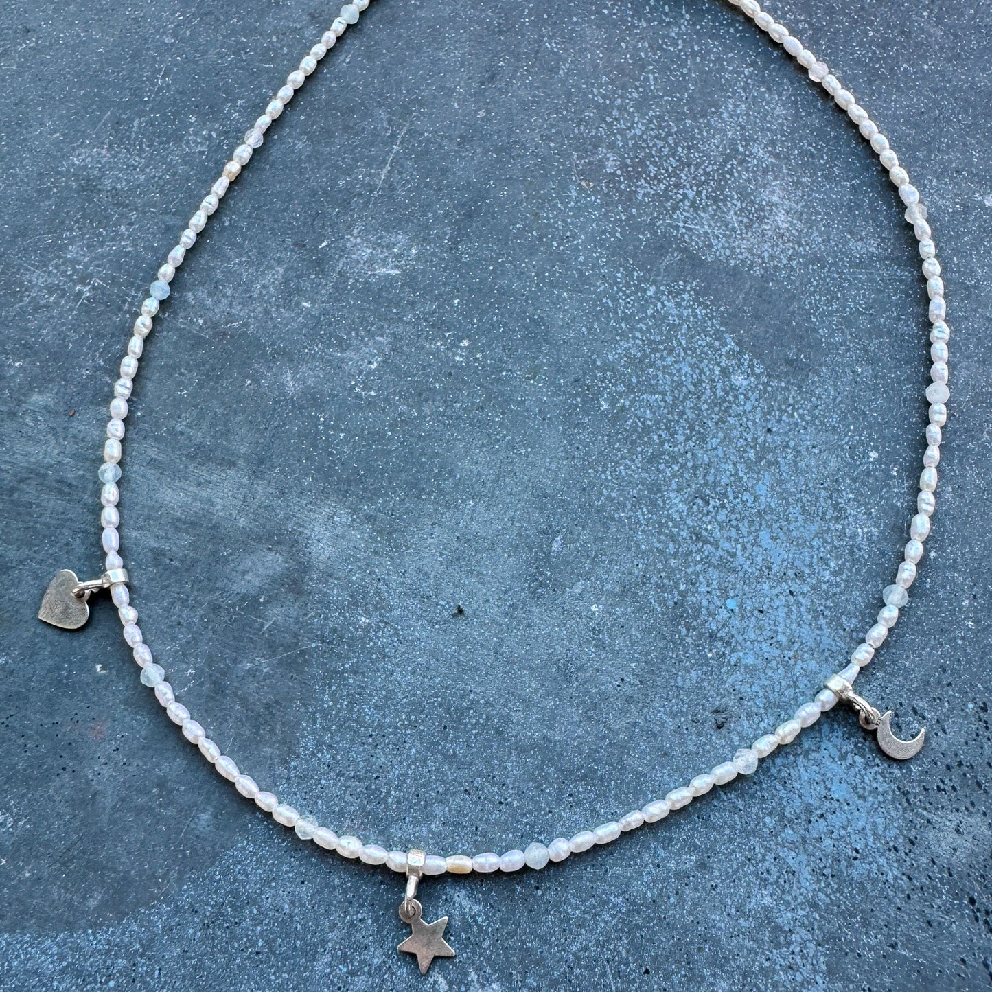 Hoi An Necklace with rice-shaped pearls and silver moon, star, and heart charms - handmade by elswre jewelry