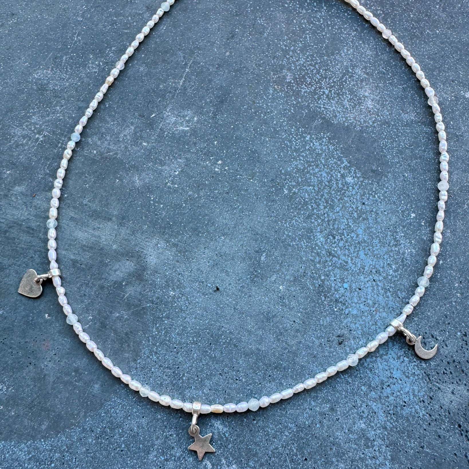 Hoi An Necklace with rice-shaped pearls and silver moon, star, and heart charms - handmade by elswre jewelry