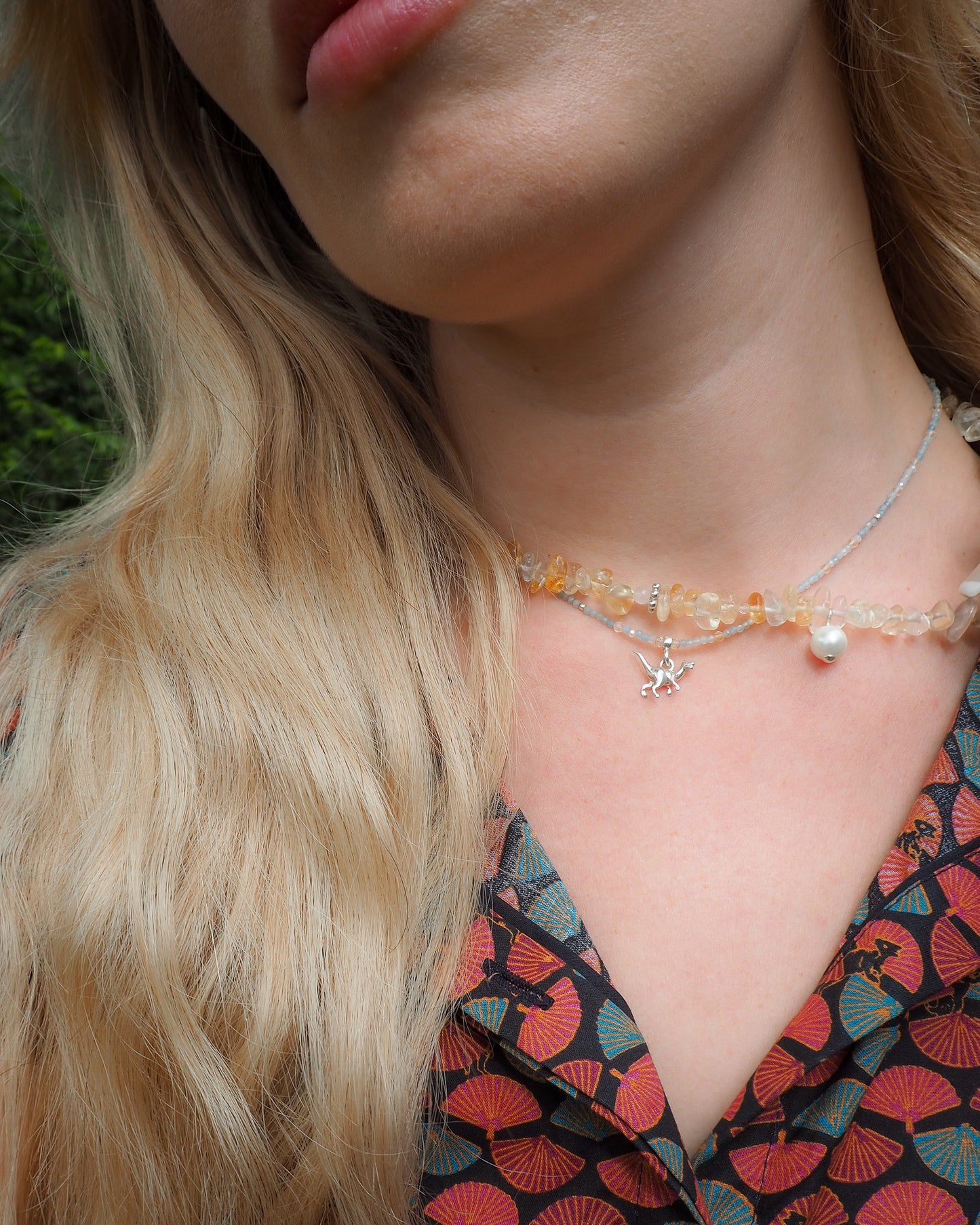 Aquamarine and light citrine beaded necklace with small silver dinosaur charm and 925 clasp – minimal travel-inspired jewelry by elswre