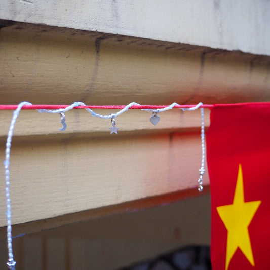 Hoi An Necklace with silver moon, star, and heart charms on rice-shaped pearls – handmade by elswre jewelry