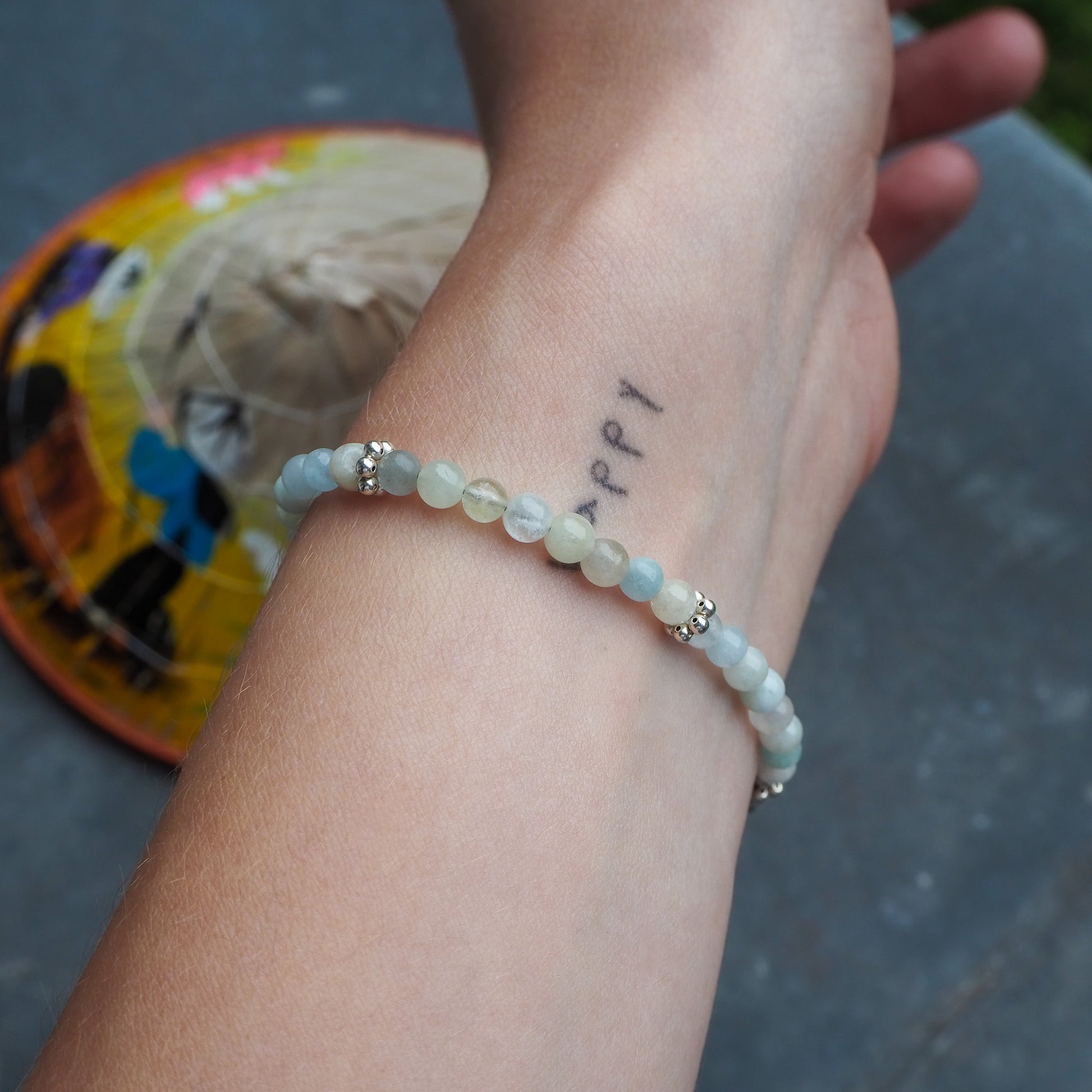 Aquamarine and silver bracelet worn on wrist – handcrafted gemstone jewelry by elswre